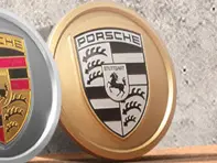 Copricerchi in colore Aurum (satinato-lucido) con stemma Porsche monocromatico per Porsche Taycan / Panamera - 9J1073000C